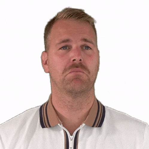 a man with a beard is wearing a white shirt with a zipper on the front