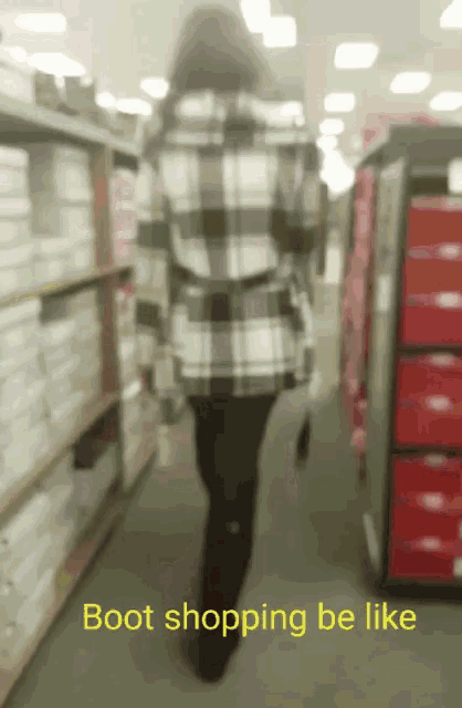 a blurred image of a person walking in a store with the words boot shopping be like