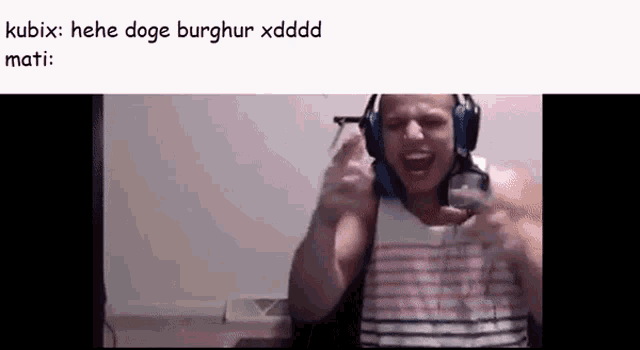 a man wearing headphones is making a funny face while holding a controller .