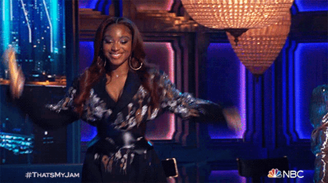 a woman is dancing on a stage with the hashtag thatsmyjam