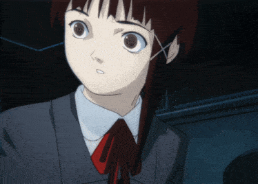a close up of a girl 's face with a red bow tie