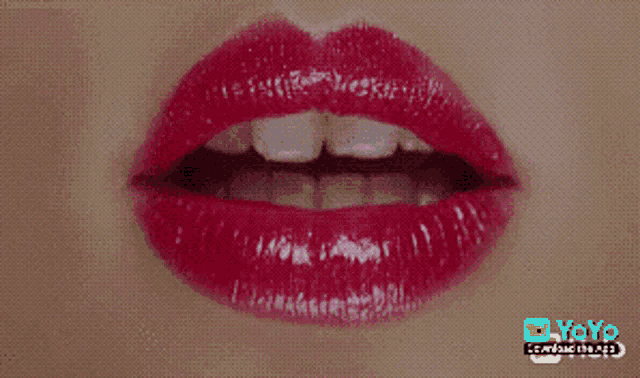a close up of a woman 's red lips with yoyo written below