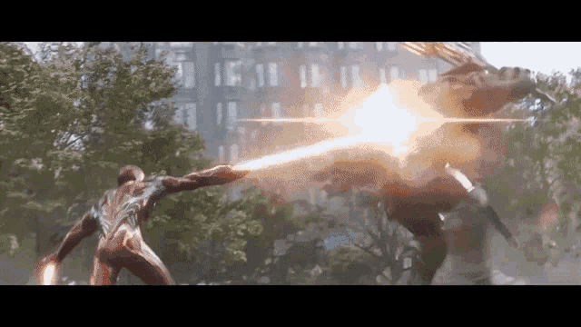 a man in a superhero costume is fighting another man with a lightning bolt .