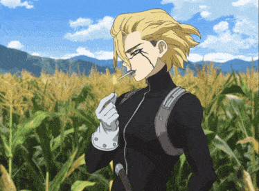 a man in a black suit is smoking a cigarette in a field of tall grass