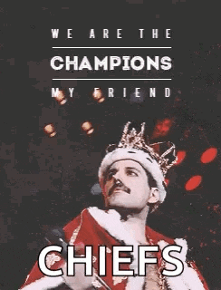 freddie mercury is wearing a crown and a king 's robe and says `` we are the champions my friend ''