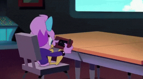 a cartoon character is sitting at a table holding a video game controller