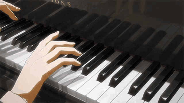 a person is playing a piano with the letters sons on the keyboard