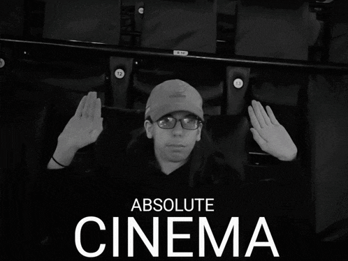 a poster for absolute cinema shows a man sitting in a chair