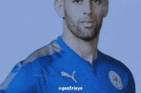 a man with a beard is wearing a blue shirt with the word puma on it