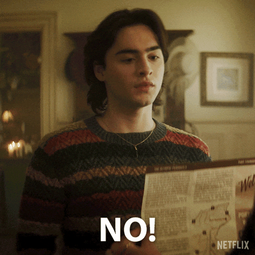 a man in a striped sweater is holding a map and says " no "