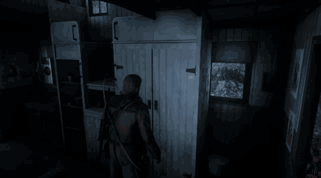 a screenshot of a video game shows a man standing in front of a cabinet that says station warriors
