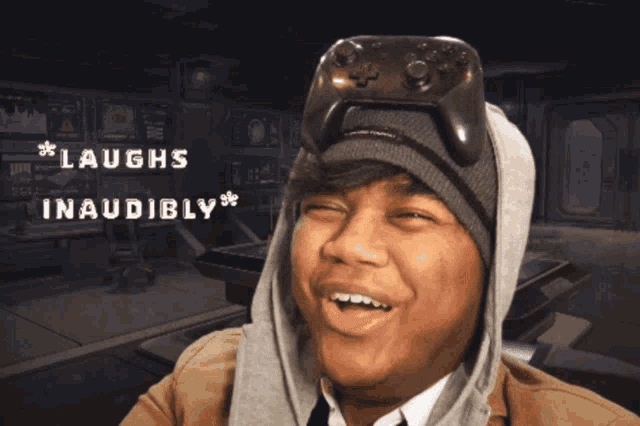 a man with a video game controller on his head is laughing