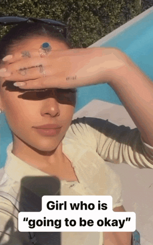 a woman covering her face with her hand with the caption girl who is " going to be okay "