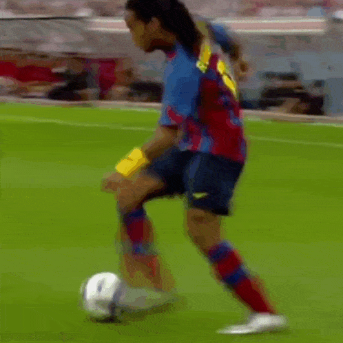 two soccer players are playing a game of soccer and one of them is wearing red socks