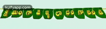 a banner made out of banana leaves that says ' kulfyapp.com '