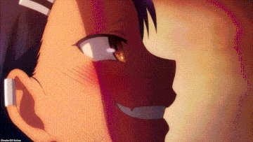 a close up of a person 's face with a smirk on it .