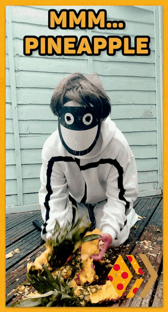 a person wearing a mask eating a pineapple with the words mmm pineapple written above them