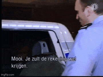 a man in a police uniform is talking to a man in a van in a foreign language
