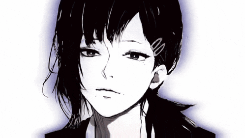 a close up of a person 's face with black hair .