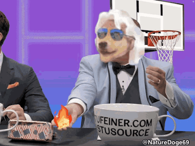 a man in a tuxedo is holding a fireball in front of a mug that says stusource