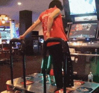 a man in a red shirt with the word arcade on the back