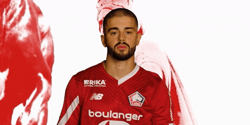 a man with a beard wears a red jersey that says boulanger on it