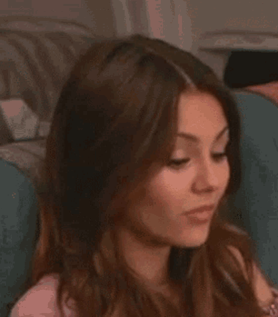 a close up of a woman making a face on a plane .