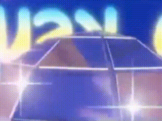 a car is driving down a street in front of a sign that says ' usn ' on it .
