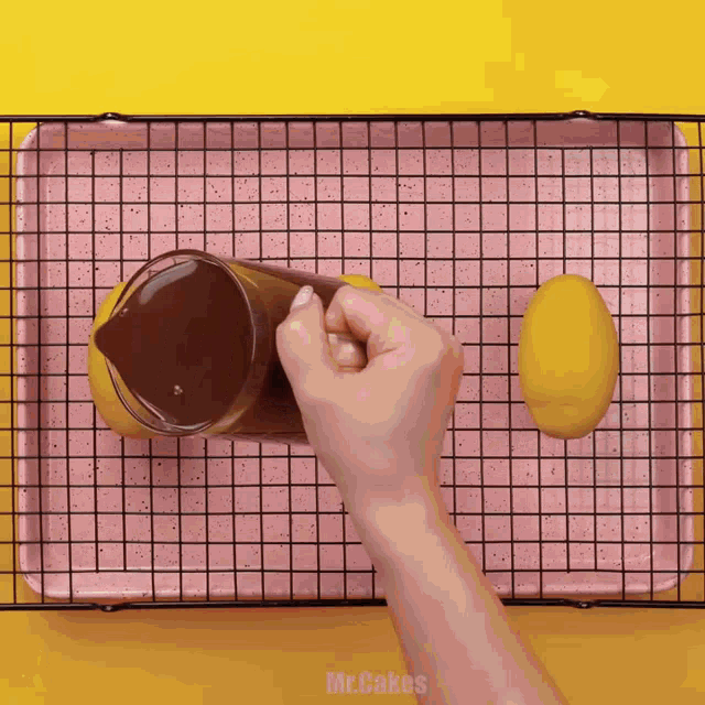 a person pouring liquid into a pitcher with the words mr.cakes below
