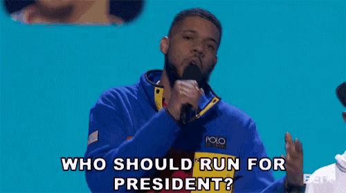 a man speaking into a microphone with the words who should run for president behind him