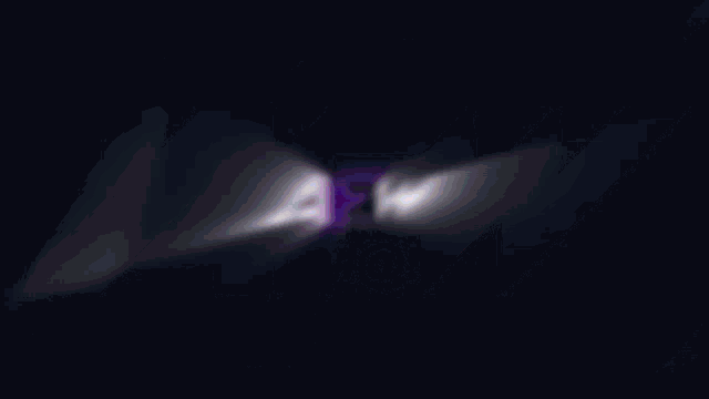 a blurry image of the letters a & w on a dark background