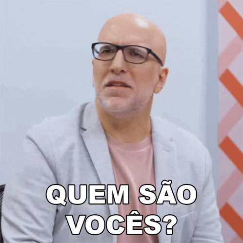 a bald man wearing glasses and a pink shirt is asking " quem sao voces "
