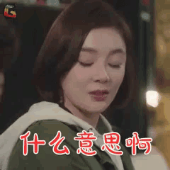 a woman with her eyes closed is wearing a green jacket and a white hoodie .