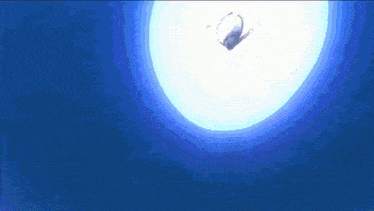 a person is flying through a blue circle in the air