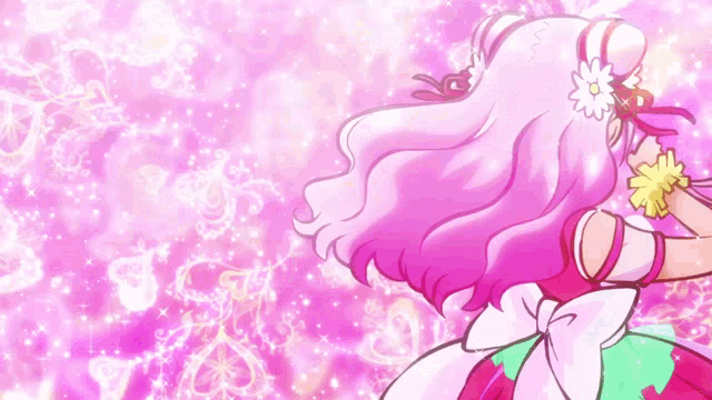 a girl with pink hair and a flower in her hair is smiling and giving a thumbs up