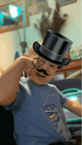 a man with a top hat and mustache on his head