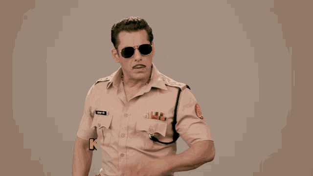 a man in a police uniform has the words kamal karte ho pandey ji written above him