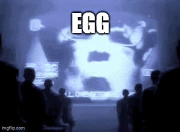 a group of people looking at a screen that says egg on it