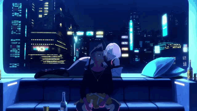 a couple sitting on a couch in front of a window with a neon sign that says rio