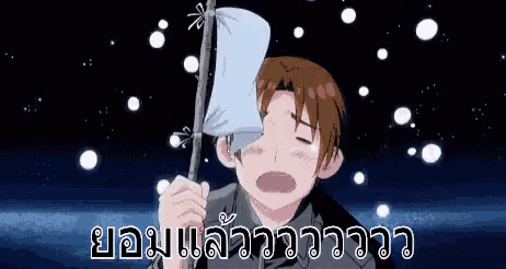 a man is holding a piece of paper in his hand and crying while holding a stick .