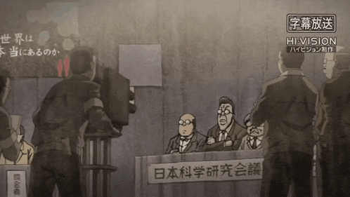 a group of men are sitting at a table with a sign that says hi-vision on it