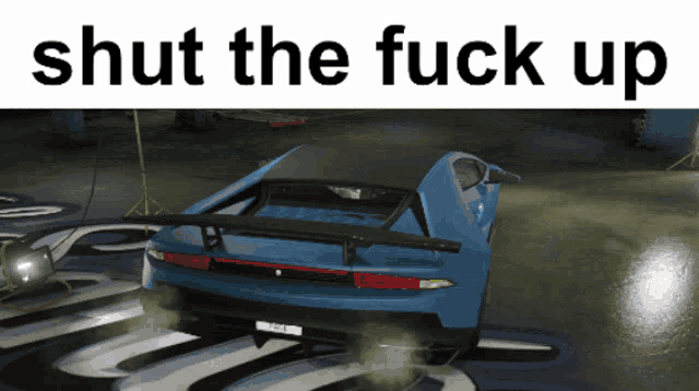a picture of a car with the words shut the fuck up behind it