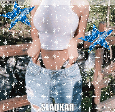 a woman in a crop top and ripped jeans is surrounded by snowflakes and the word sladkaa