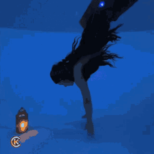 a picture of a mermaid with a r on the bottom right