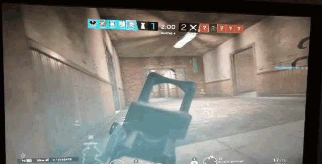 a video game screen shows a hallway with a clock that reads 2:00