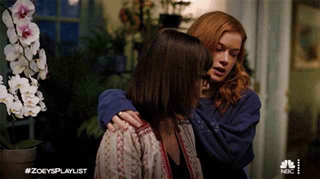 two women hugging each other with the hashtag #zoeysplaylist