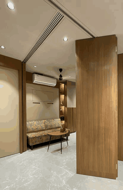 a living room with a couch and a table and a ceiling fan