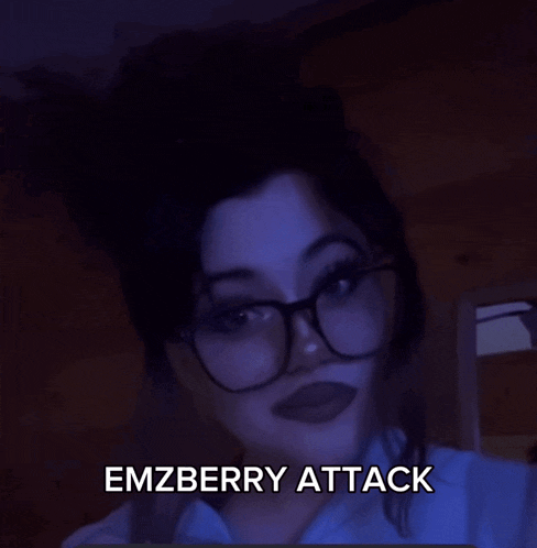 a blurry picture of a person with the words emzberry attack written in white