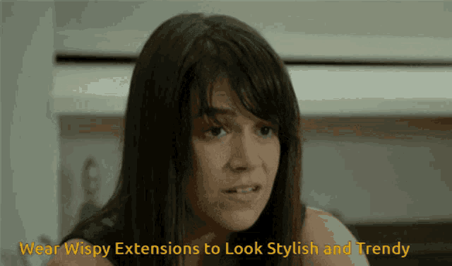 a woman is wearing wispy extensions to look stylish and trendy ..