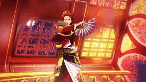 a man in a kimono is holding a fan in his hand while dancing in a room .
